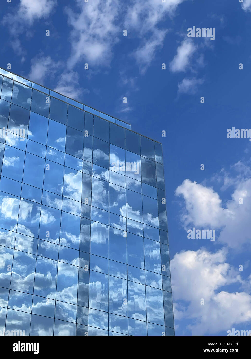 Sky reflected on glass facade. - Smartphone Captured Stock Image
