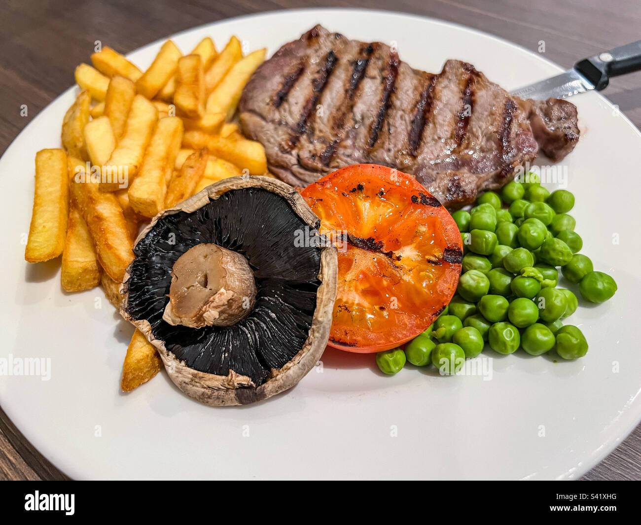 Sirloin steak and fries meal Stock Photo