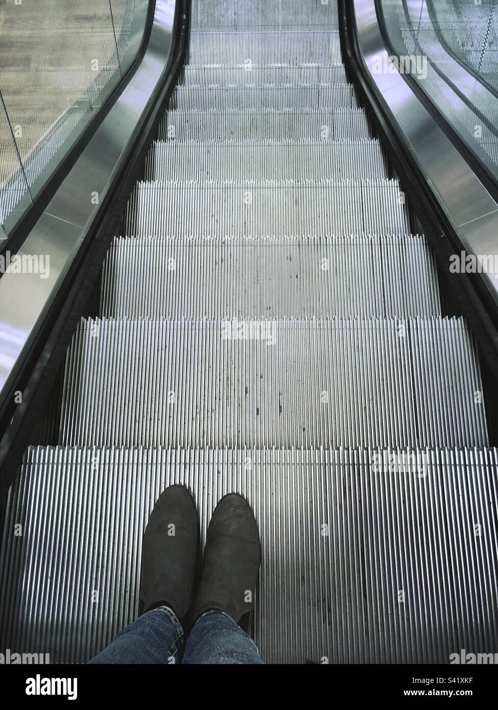 Going down an escalator in a shop - Smartphone Captured Stock Image