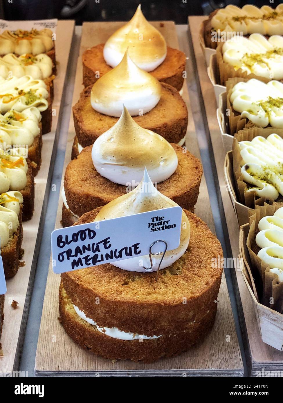 Blood Orange Meringue in bakery shop window Stock Photo Alamy