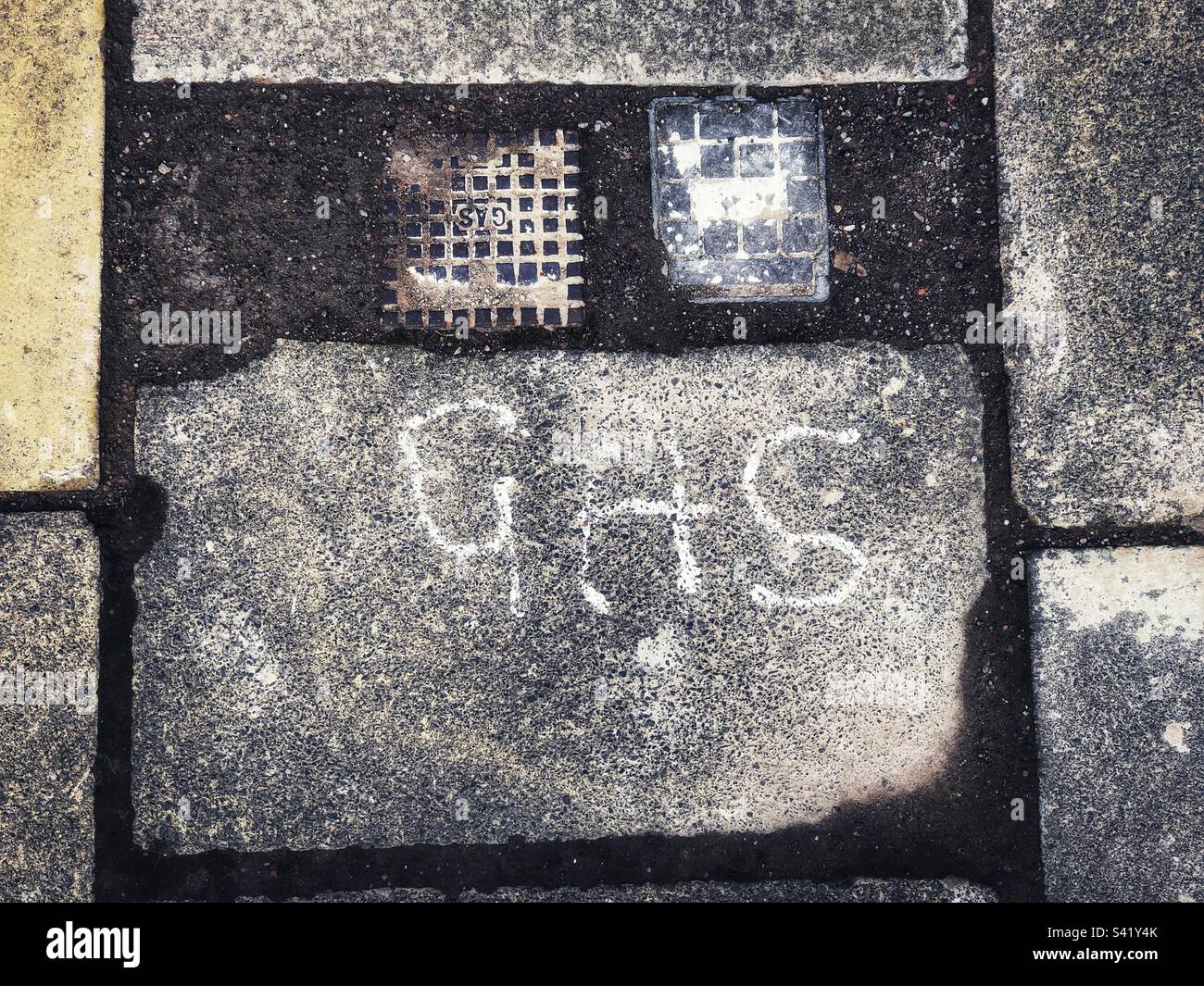 Gas main cover on pavement - Smartphone Captured Stock Image