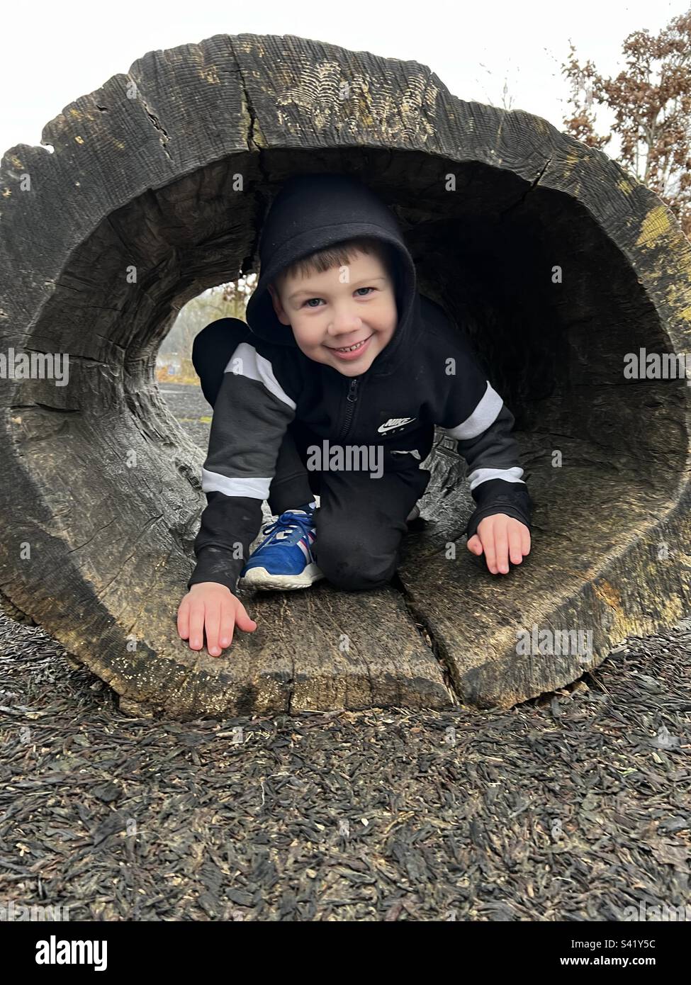 Boy in wood tunnel Stock Photo Alamy
