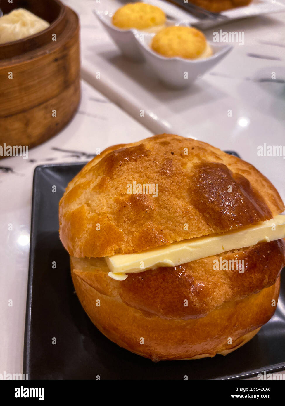 Hong Kong pineapple bun with butter Stock Photo Alamy