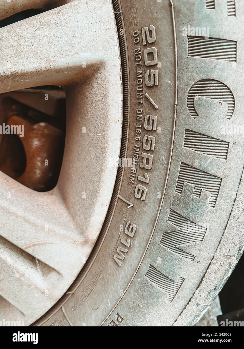 Tyre size and speed ratings embossed on the side of a car tyre Stock