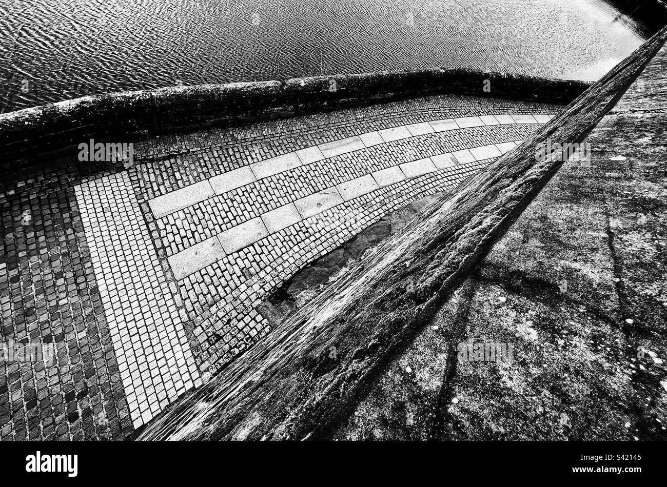 Cobbles on riverside walk by Rivet Dee in Chester. Viewed from above from city walls. - Smartphone Captured Stock Image