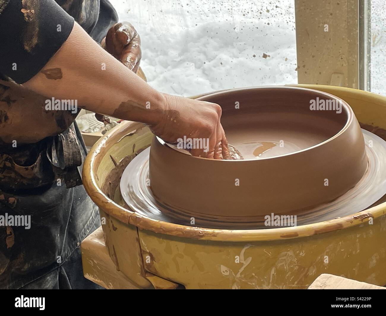 Clay on Pottery wheel being formed Stock Photo Alamy