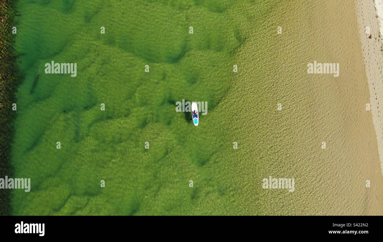 Paddle Boarding on Crystal Clear Water - Smartphone Captured Stock Image