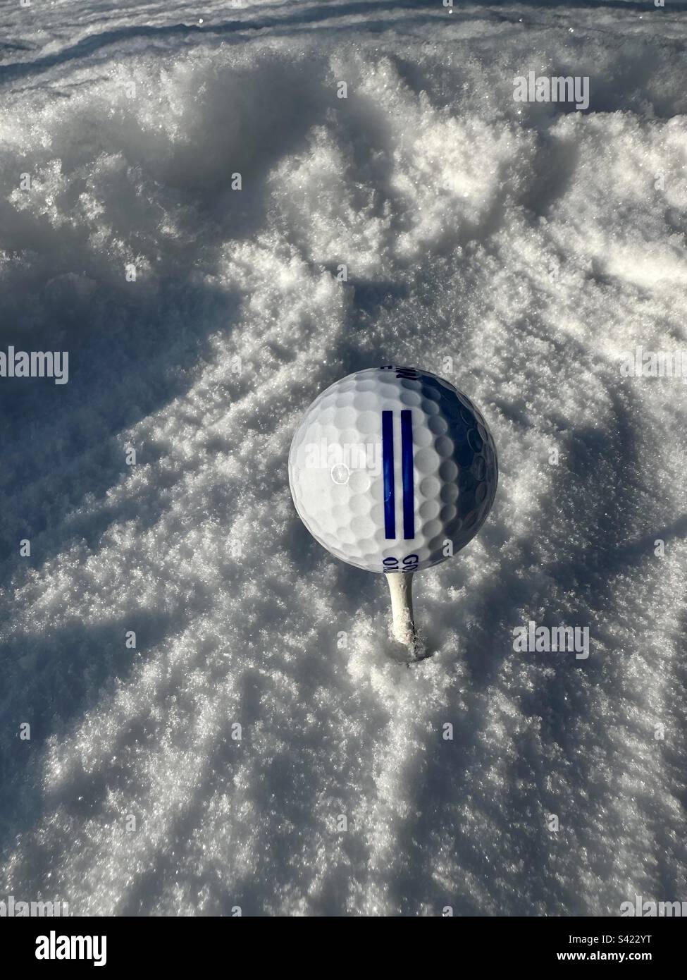 Golf ball in snow - Smartphone Captured Stock Image