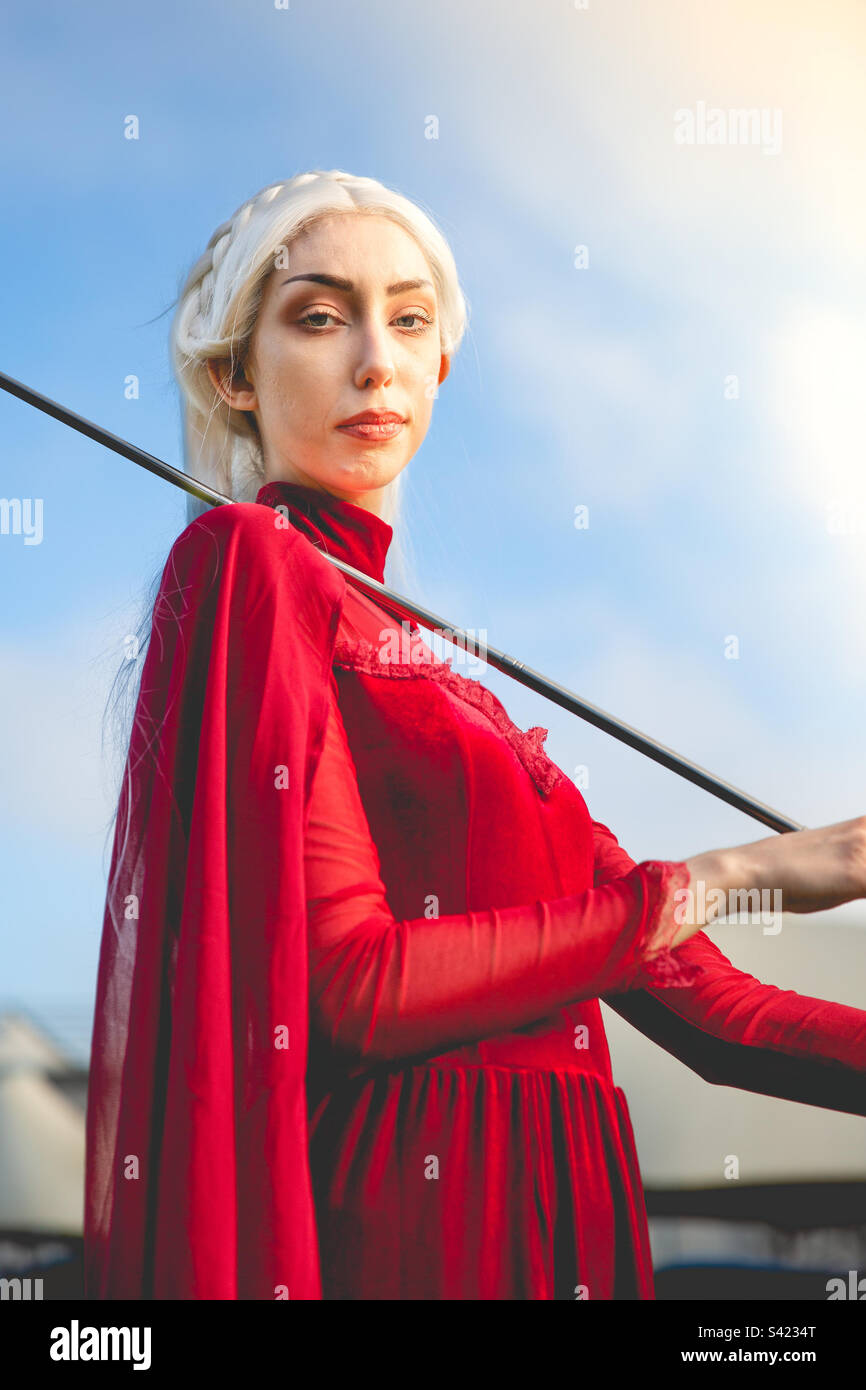 Beautiful girl cosplayer in elegant red dress - Smartphone Captured Stock Image