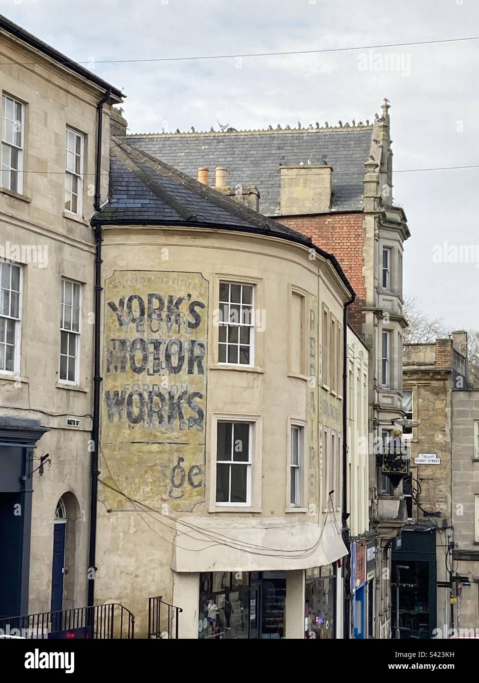 Ghost sign on an old building in Frome, Somerset - Smartphone Captured Stock Image Ghost sign on an old building in Frome, Somerset - Smartphone Captured Stock Image