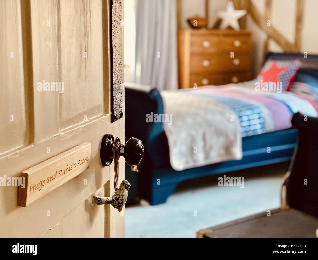 Door opening to a child’s bedroom Stock Photo Alamy