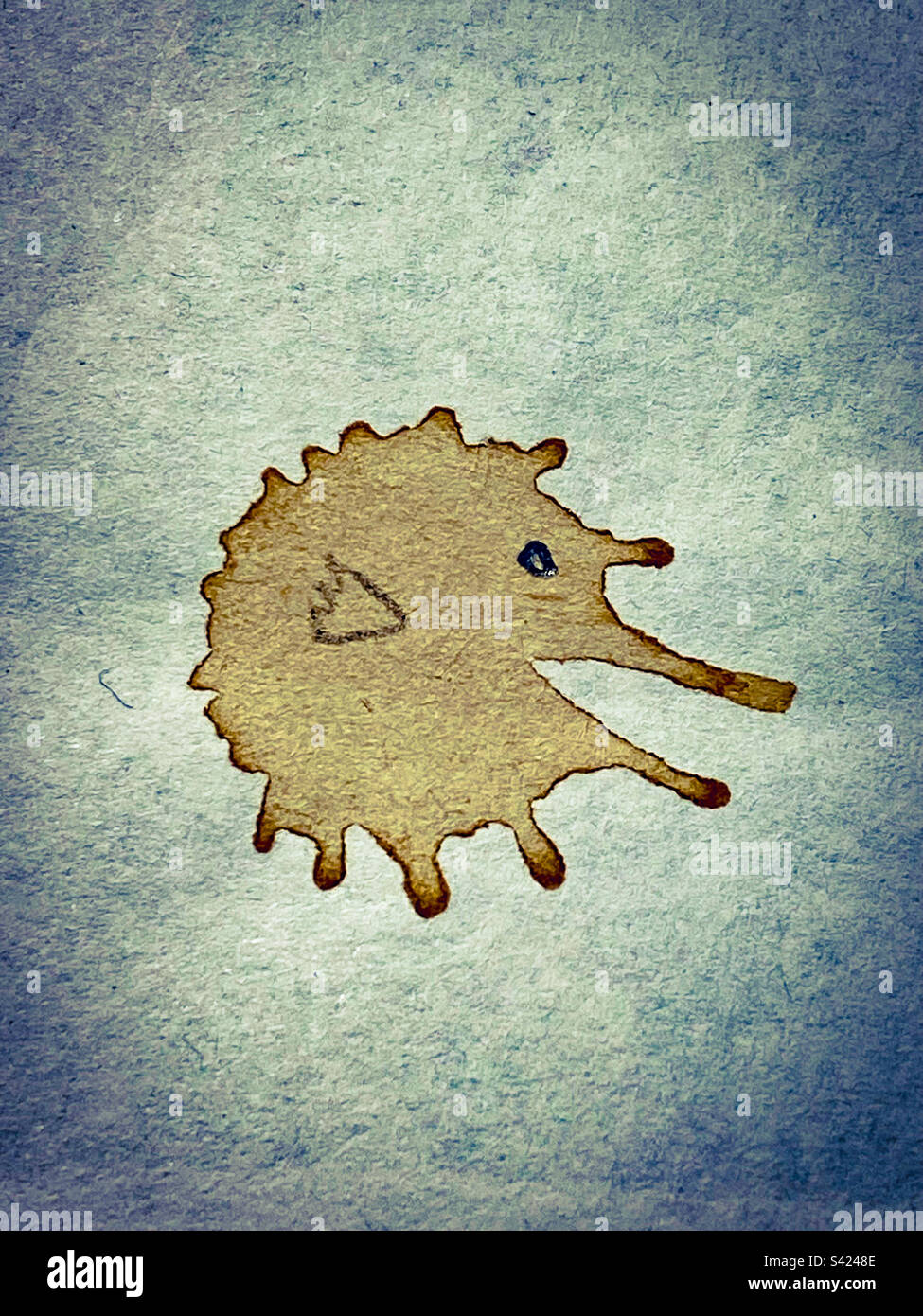 A coffee stain doodle on a notepad on a workdesk - Smartphone Captured Stock Image