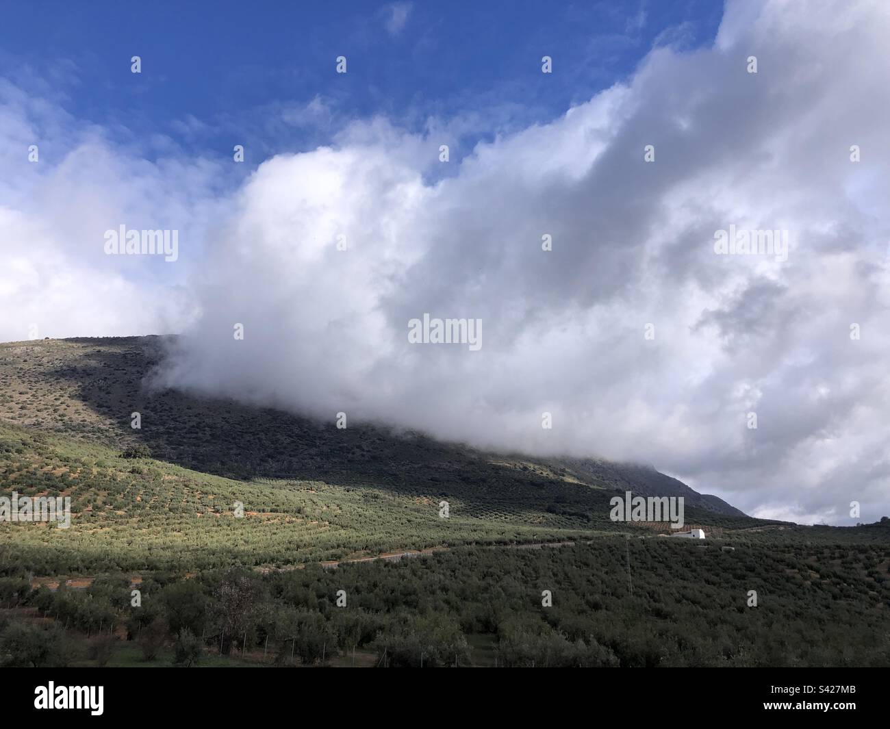 Dramatic cloudscape on mountains in Andalucía Cordoba Spain - Smartphone Captured Stock Image