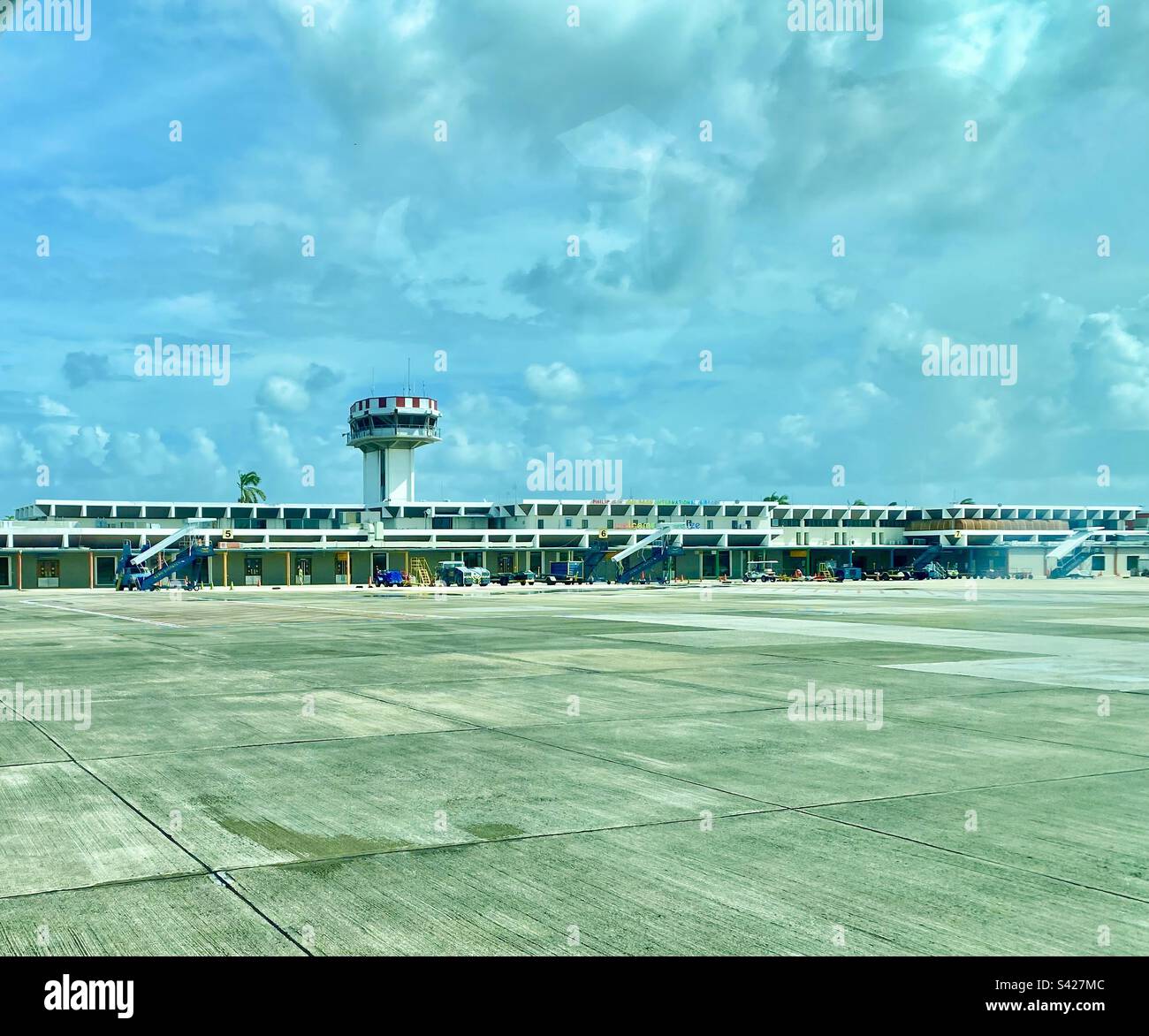 View from airplane on Tarmac at Philip S.W. Goldson International Airport, Belize City. - Smartphone Captured Stock Image