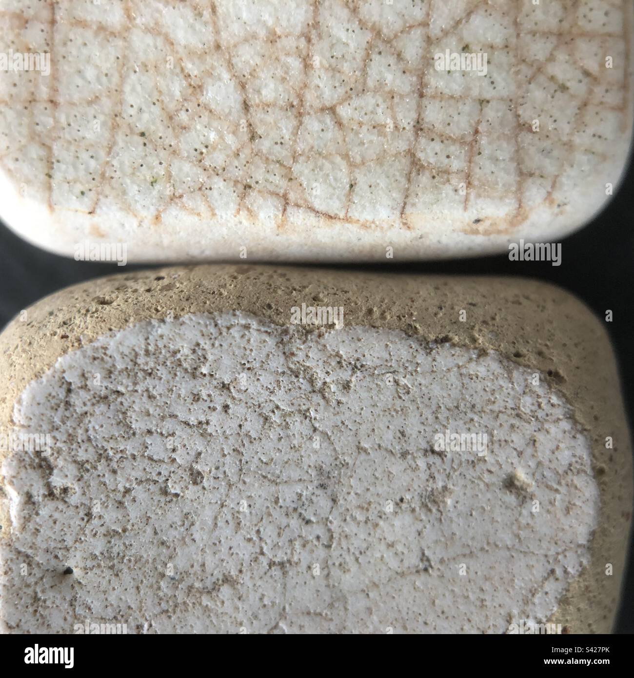 Closeup of pottery fragments shows wear from being in water of Thames river - Smartphone Captured Stock Image