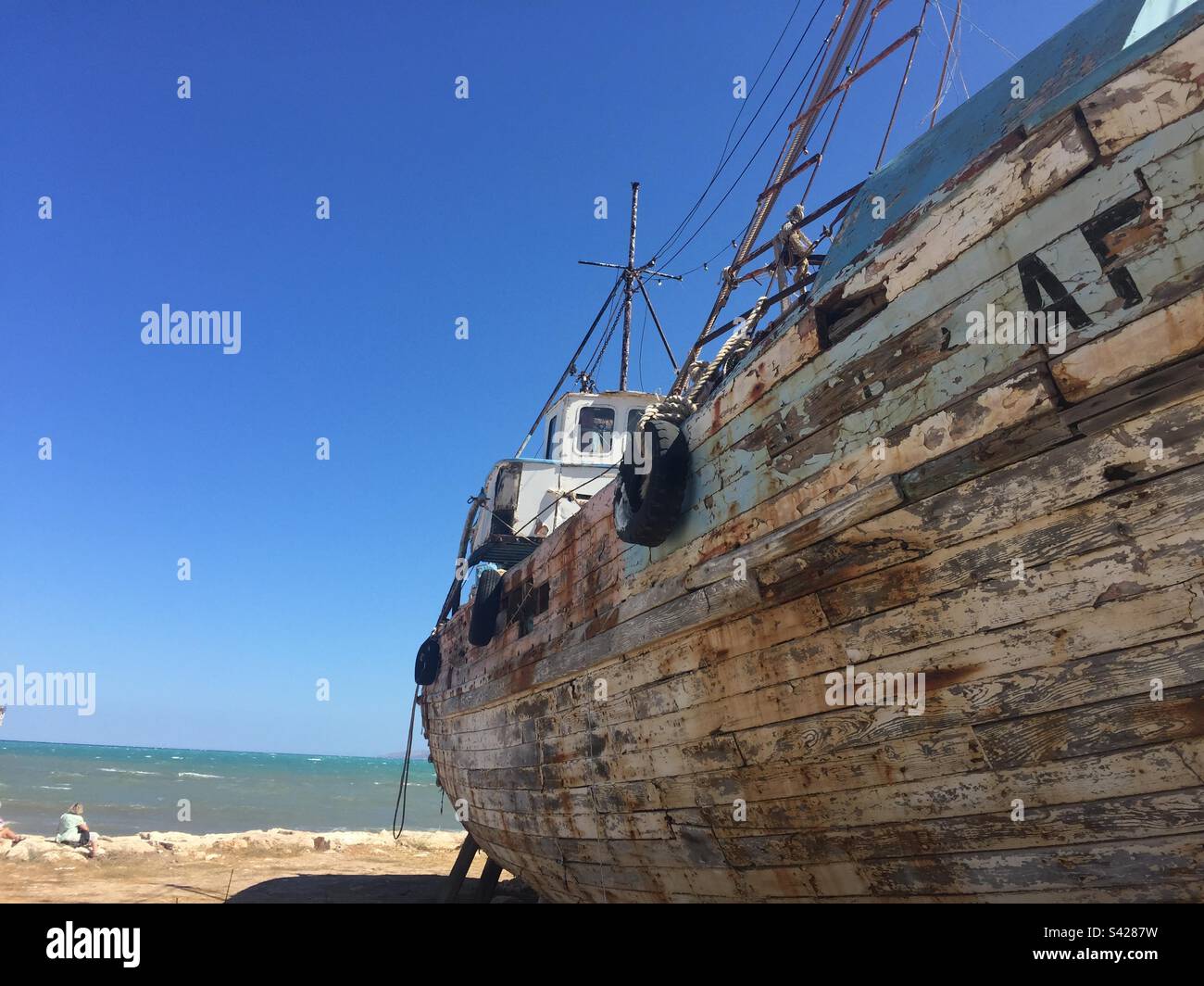 Wrecked wooden fishing boat Stock Photo