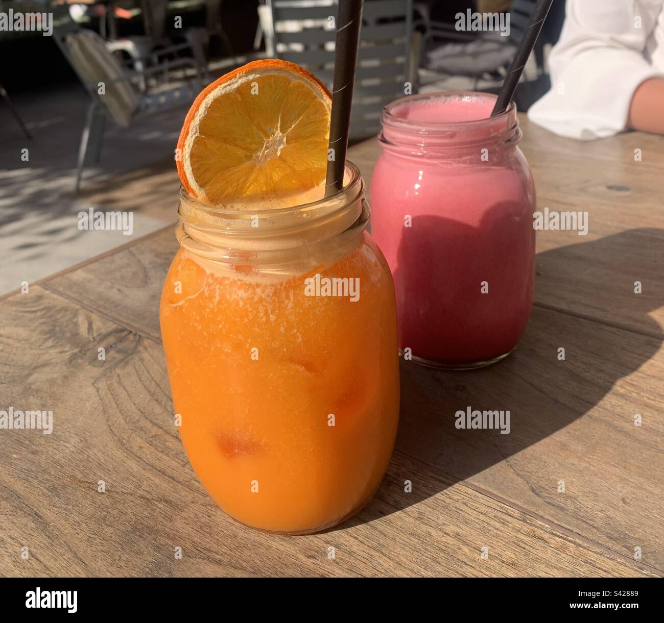 Close up image of fresh juices on an outdoor terrace - Smartphone Captured Stock Image