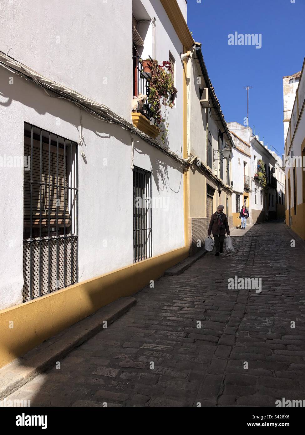 People are walking in narrows streets of cordoba Spain - Smartphone Captured Stock Image