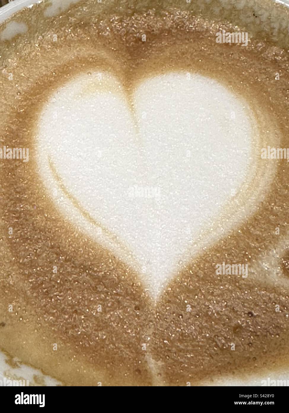 Cappuccino with heart shaped at the bar - Smartphone Captured Stock Image