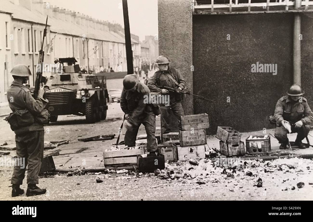1972 Belfast NI Bloody Sunday. British troops destroy captured Molotov cocktails (petrol bombs) Stock Photo