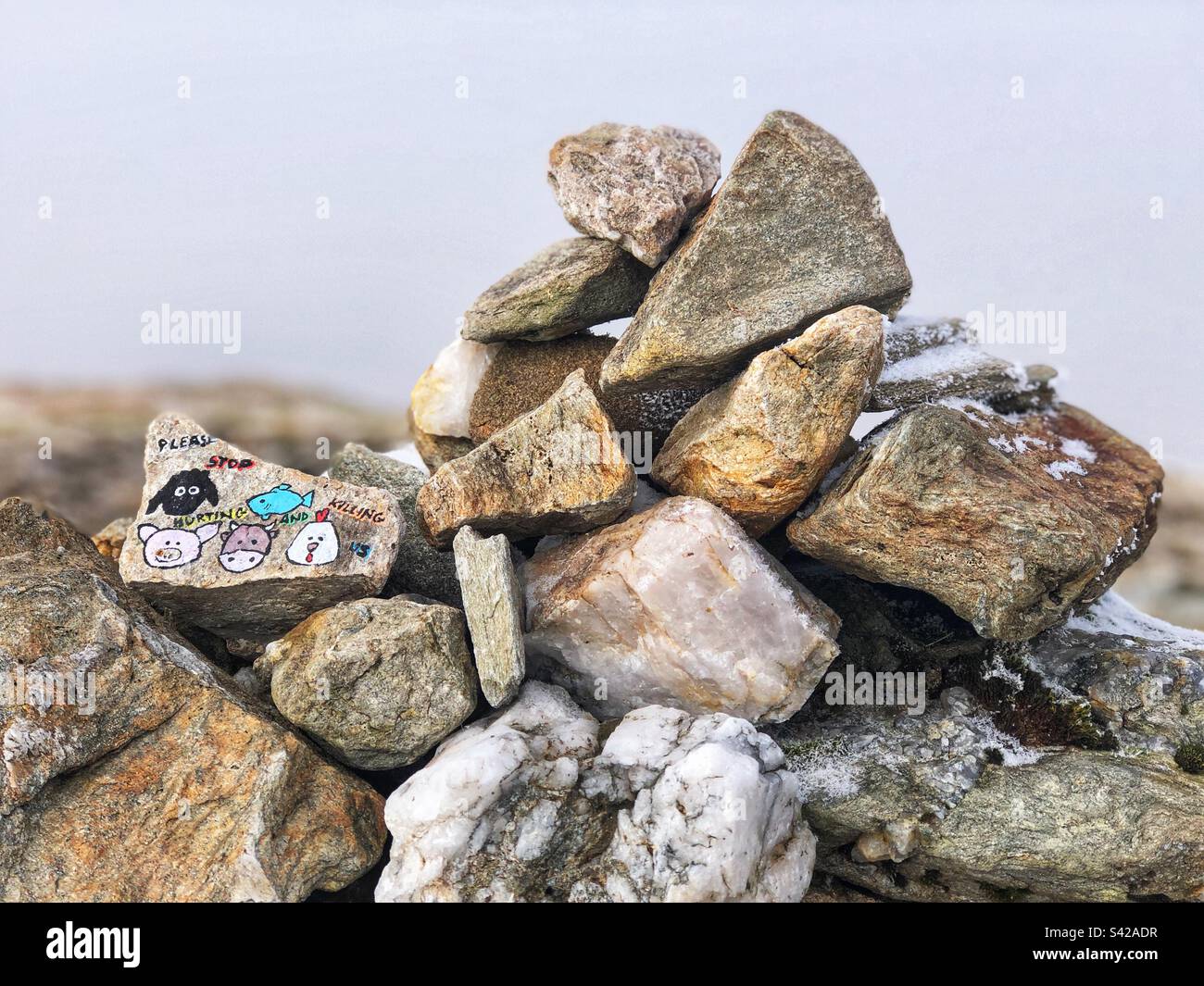 Summit Cairn with art on the summit of the Misty Scottish mountain An Caisteal, Crianlarich - Smartphone Captured Stock Image