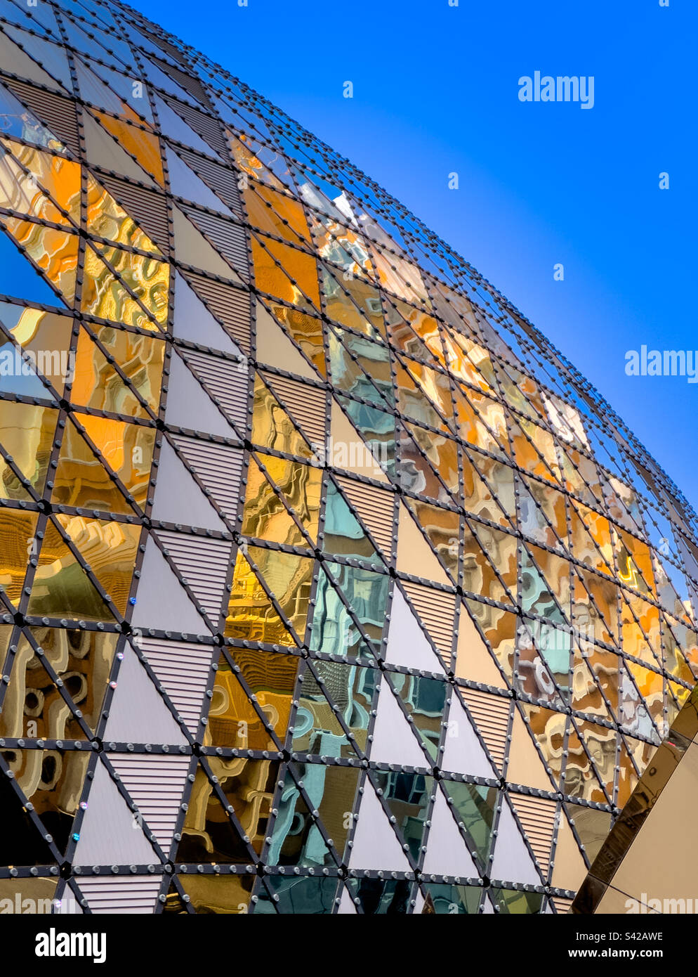 Exceedingly colorful glass and steel architecture close up of the famed Grand Lisboa Macau Hotel and Casino in Macau, China - Smartphone Captured Stock Image