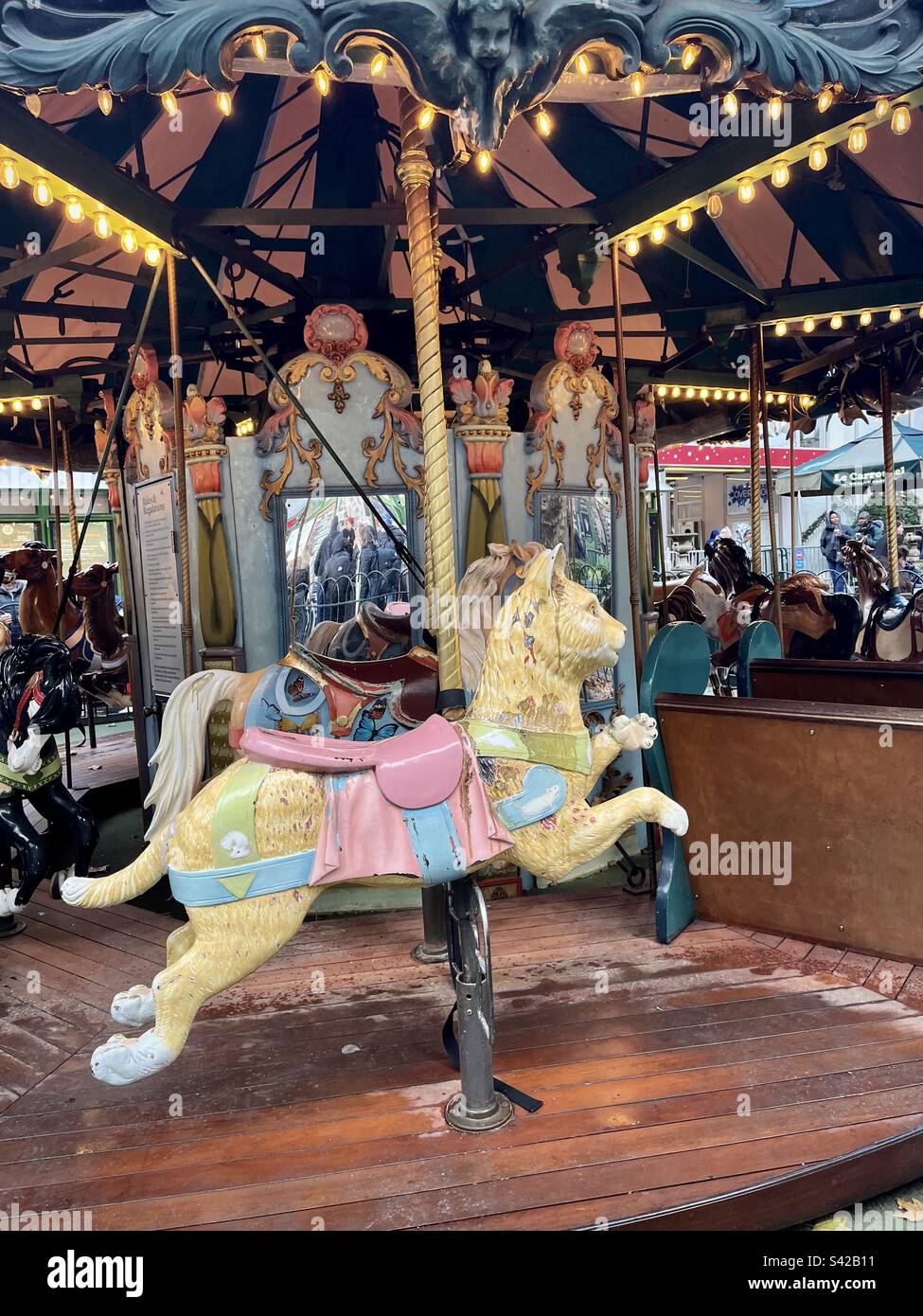 View of an old carousel with its colorful wooden horses. Photo taken in New York in December 2022 Stock Photo