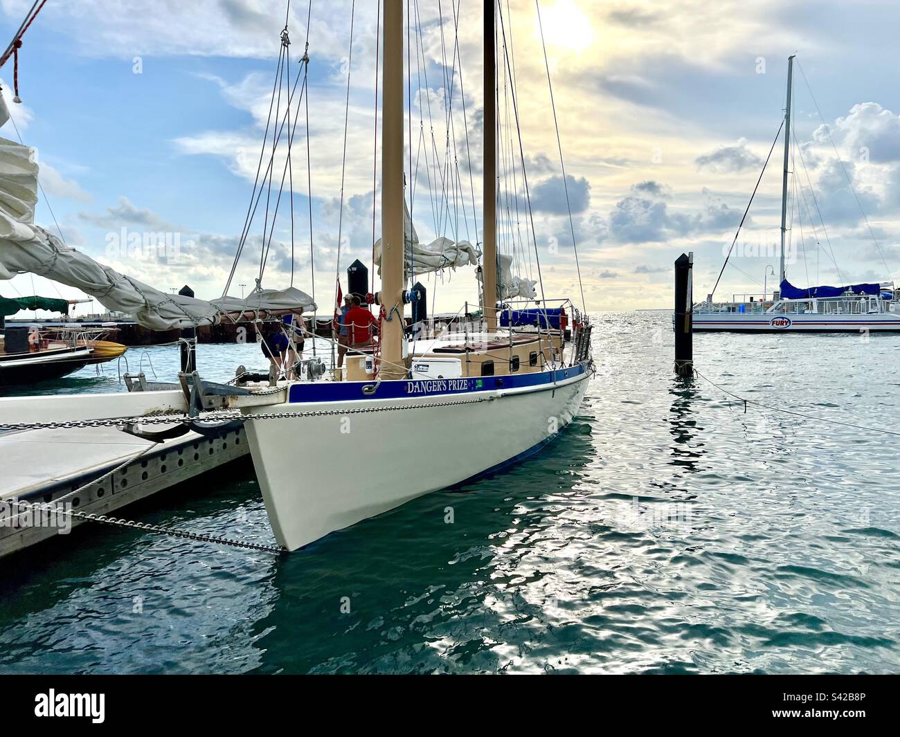 Sailboat docked at a pier in Key West, Florida - Smartphone Captured Stock Image