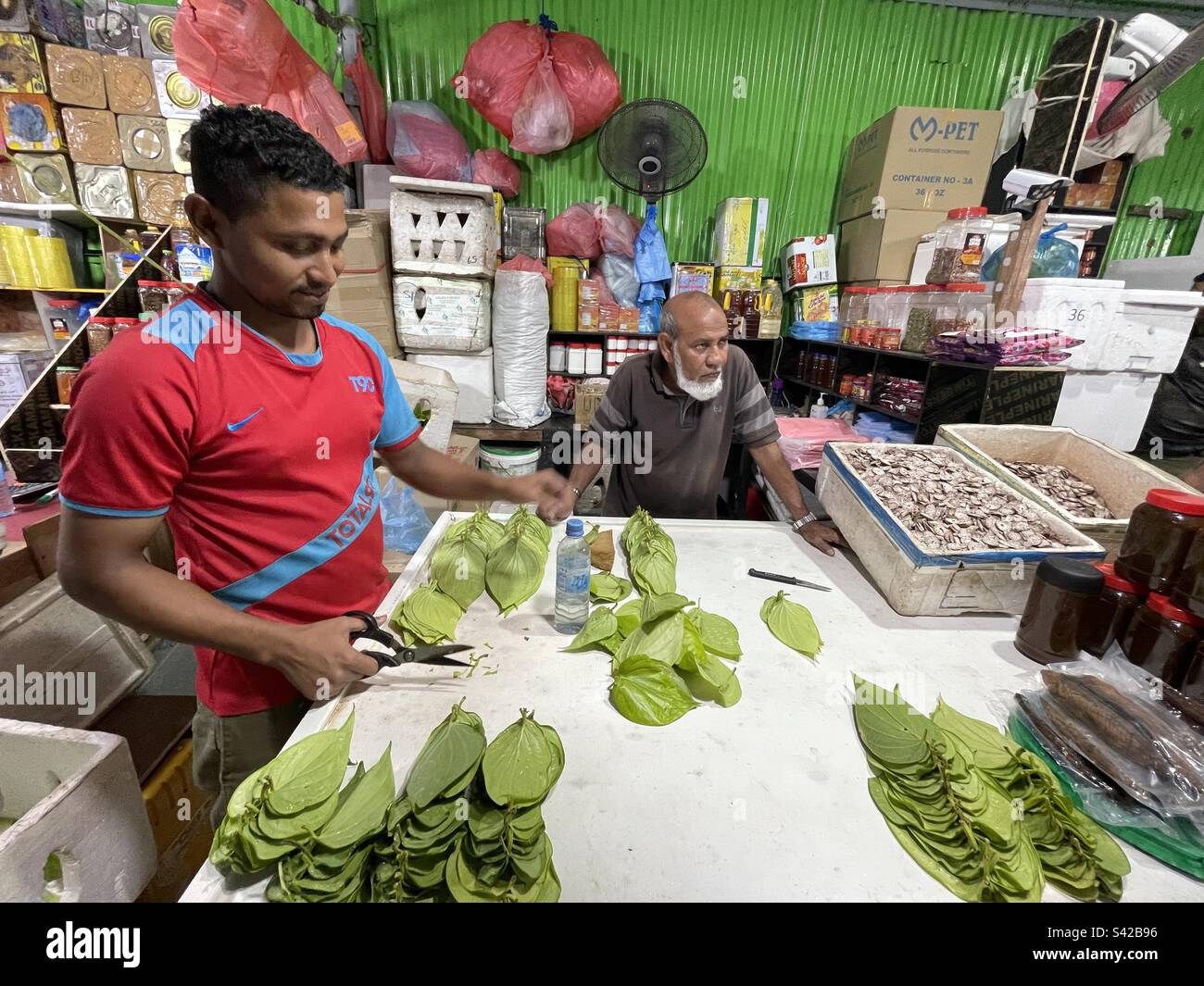 Market stall holders show their goods in Male Stock Photo Alamy