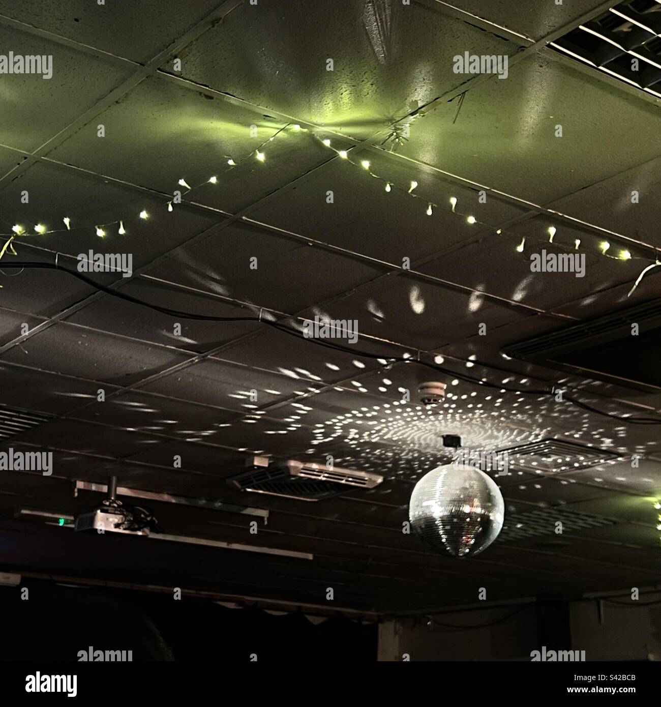 Disco ball rotating at community hall Oxford - Smartphone Captured Stock Image