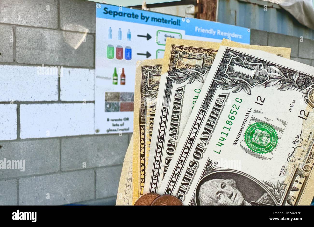 Exchanging trash for cash at a recycling center Stock Photo Alamy