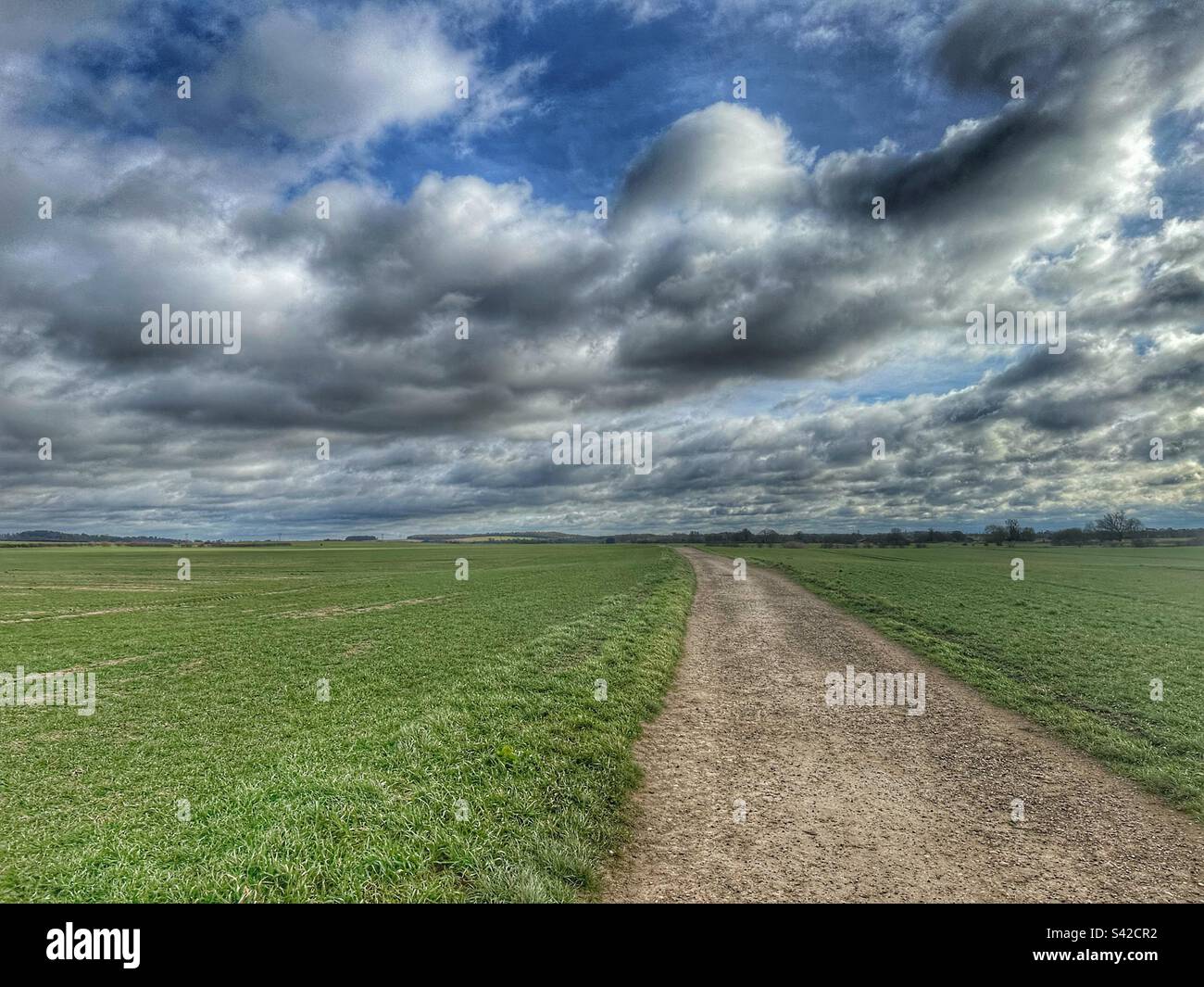 Track across fields with cloudy sky - Smartphone Captured Stock Image