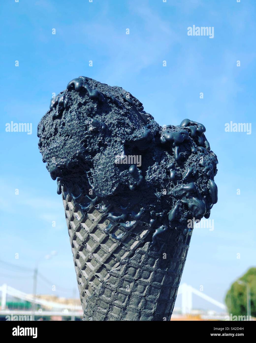 Black ice cream in a black waffle cone - Smartphone Captured Stock Image