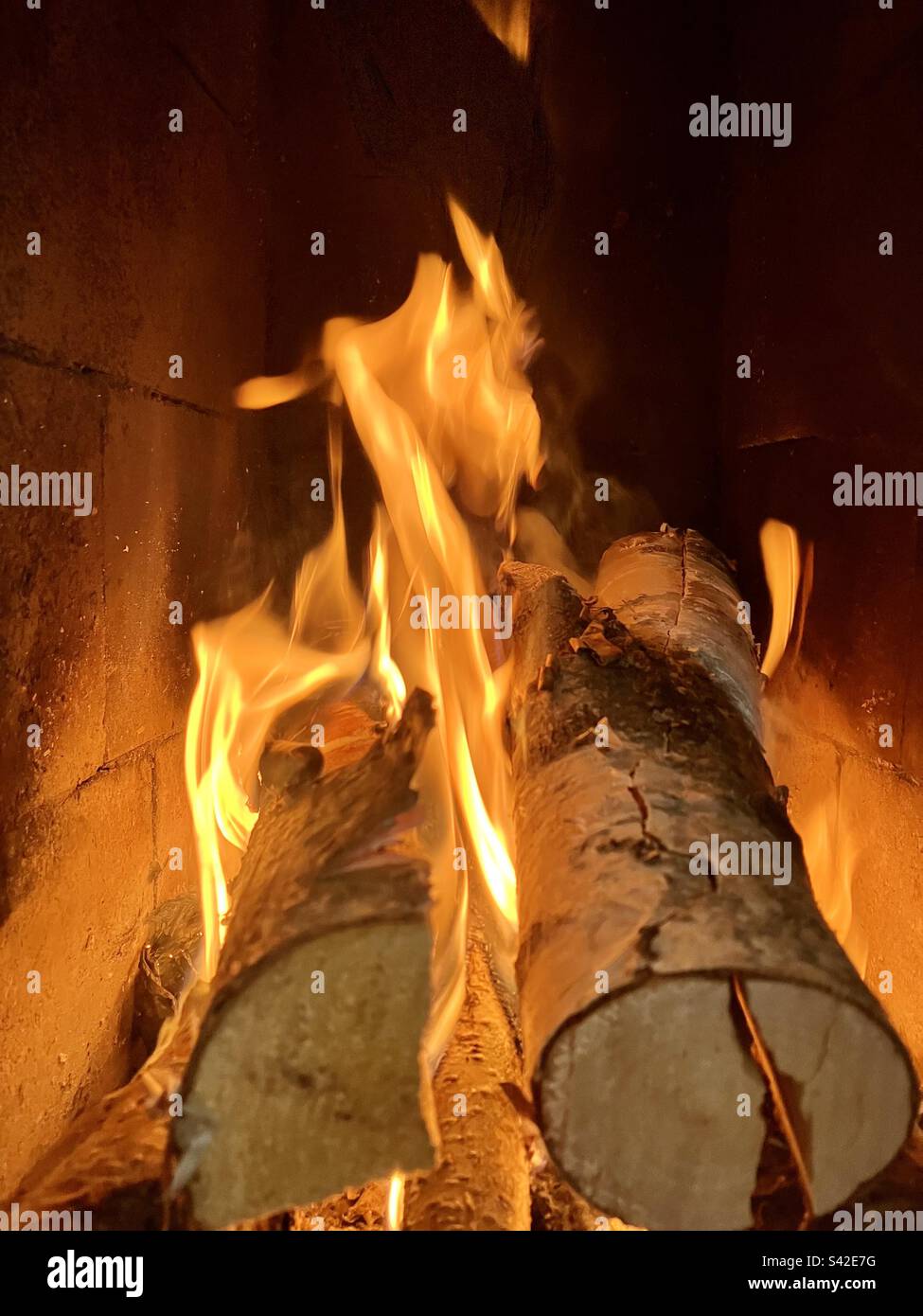 Burning logs in fireplace Stock Photo Alamy