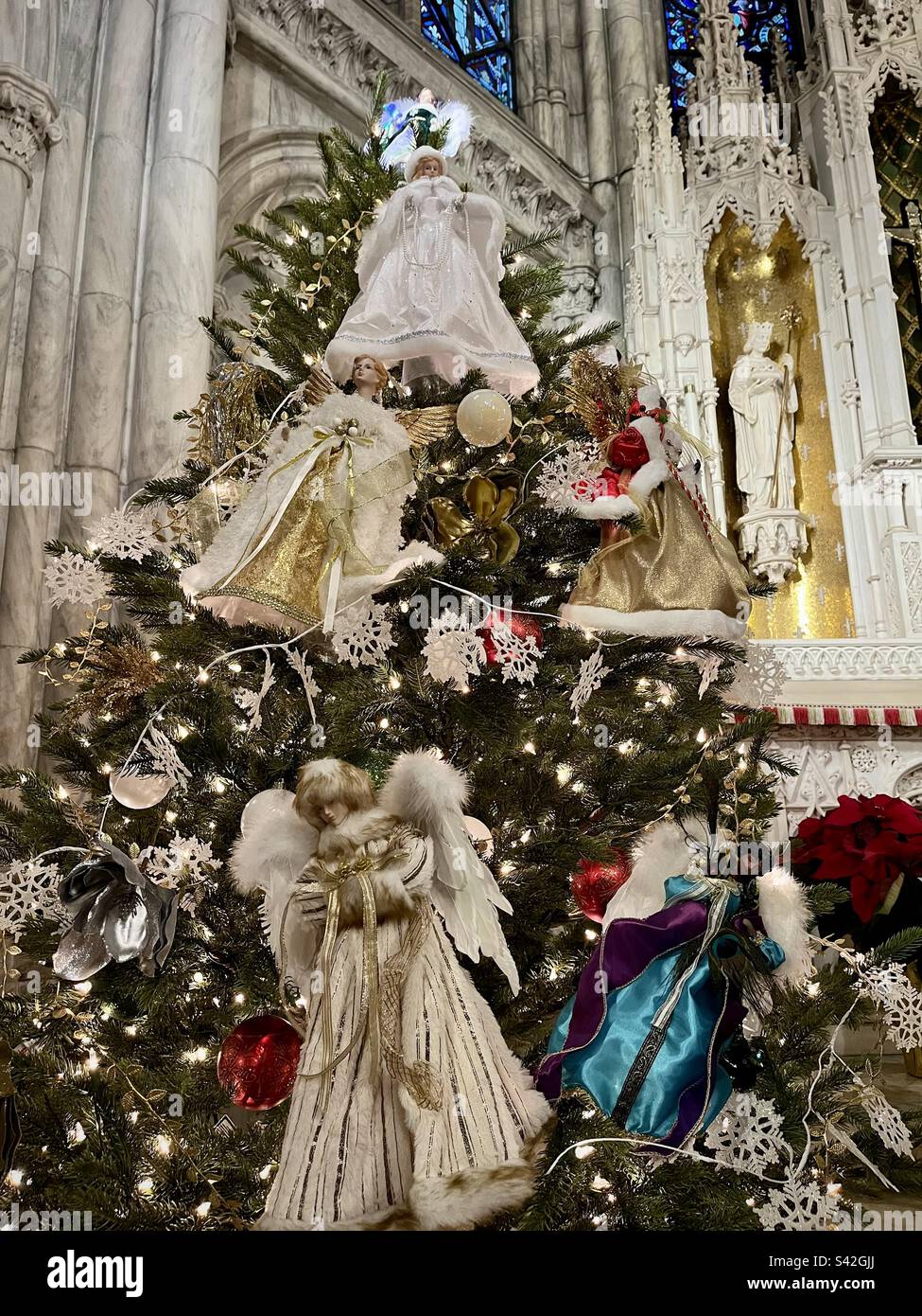 Christmas tree decorated with angels inside St. Patrick's Cathedral in New York. Photo taken in New York in December 2022 Stock Photo
