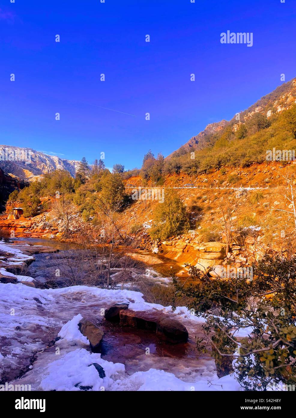 Slide rock state park with snow and waterfalls in Arizona Stock Photo