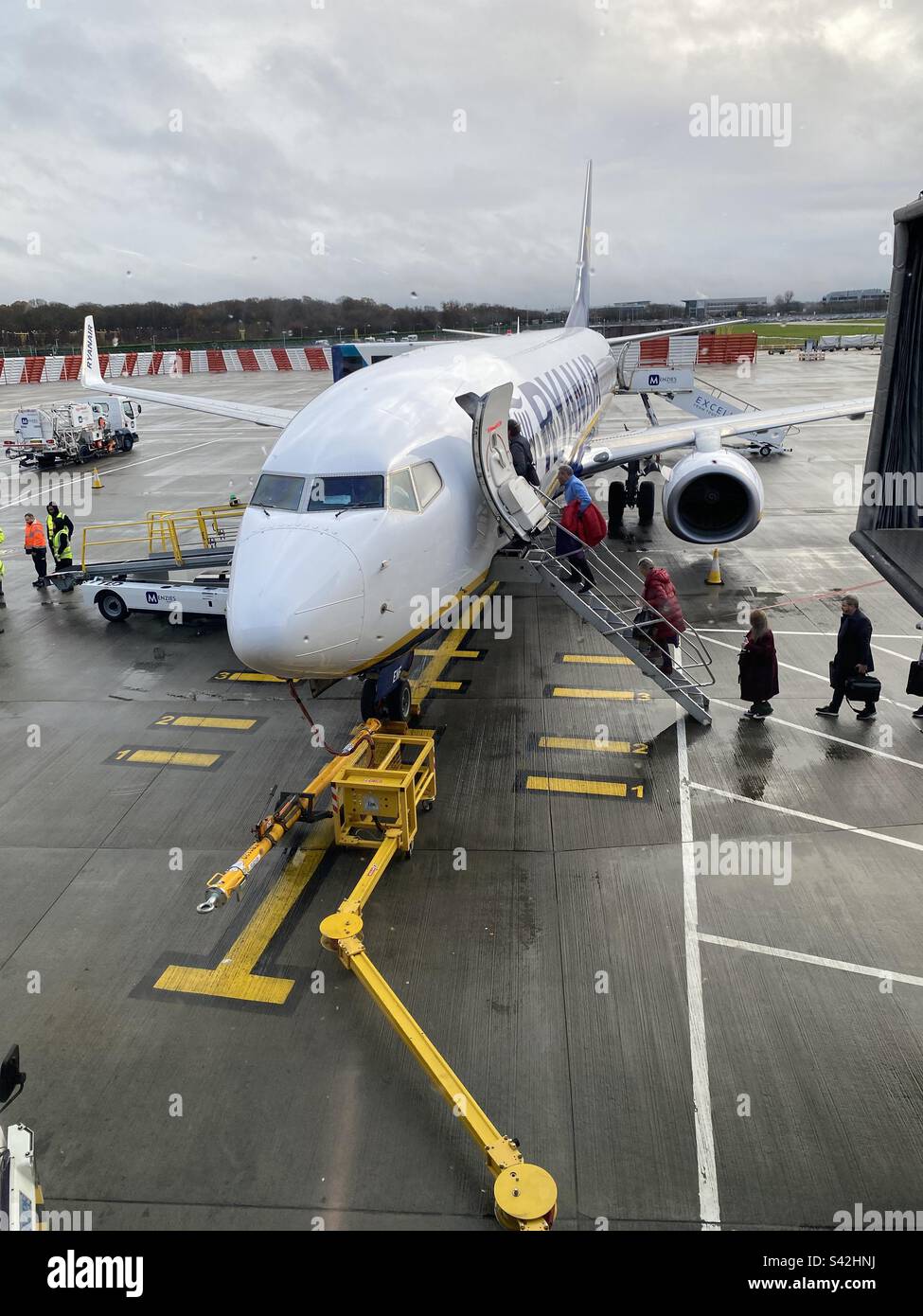 Passengers boarding a Ryanair plane Stock Photo Alamy