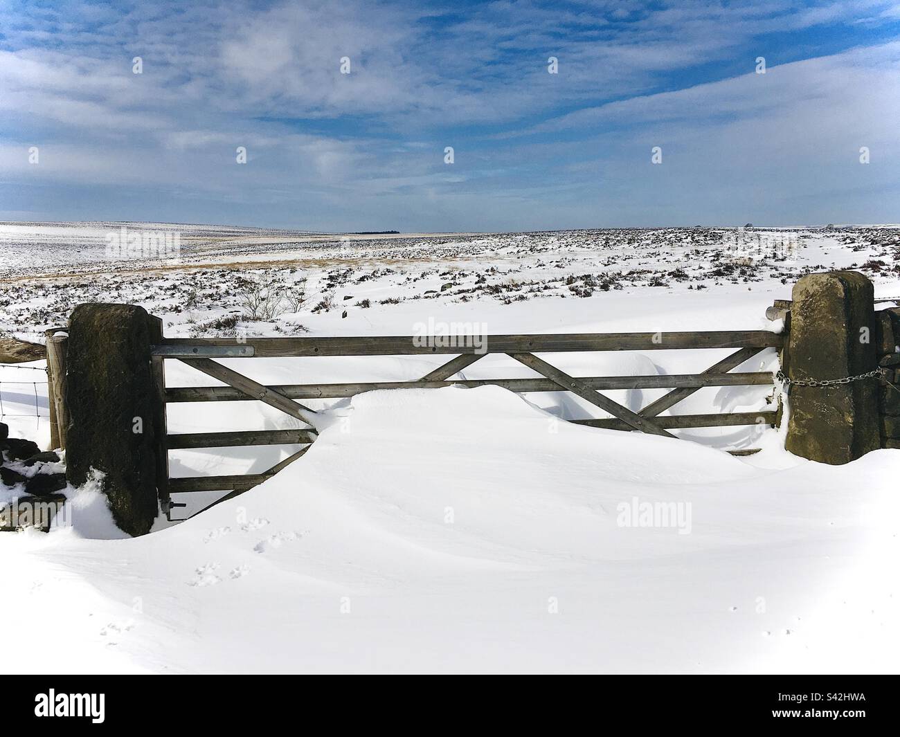 Derbyshire Peak District National Park Drifting snow against a farm gate in the Derbyshire Peak District National Park Derbyshire England UK GB Europe - Smartphone Captured Stock Image