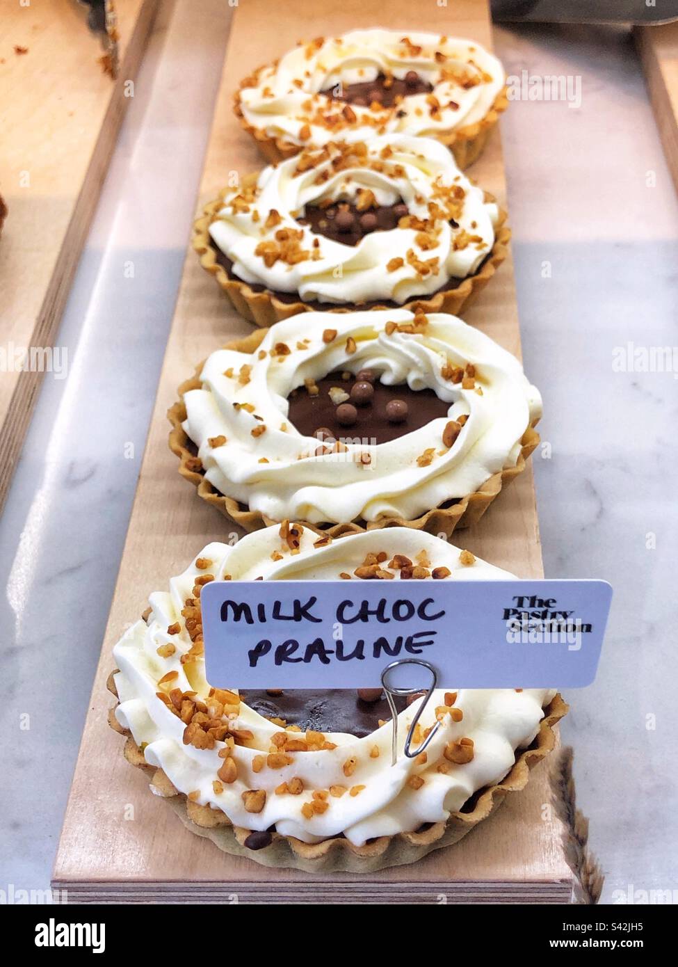 Milk Chocolate Praline in bakery shop window - Smartphone Captured Stock Image