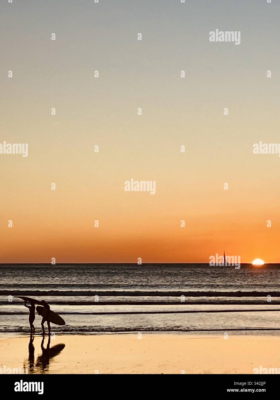 Endless summer, surf on the ocean. Surf session at sunset - Smartphone Captured Stock Image