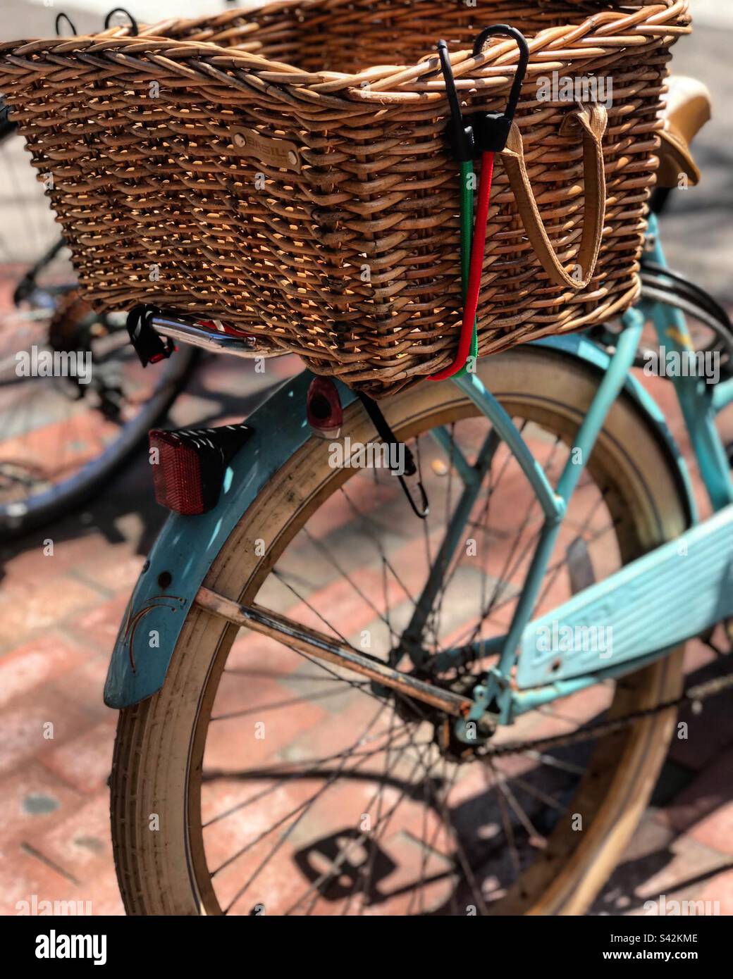 Blue bike with vintage basket Stock Photo Alamy
