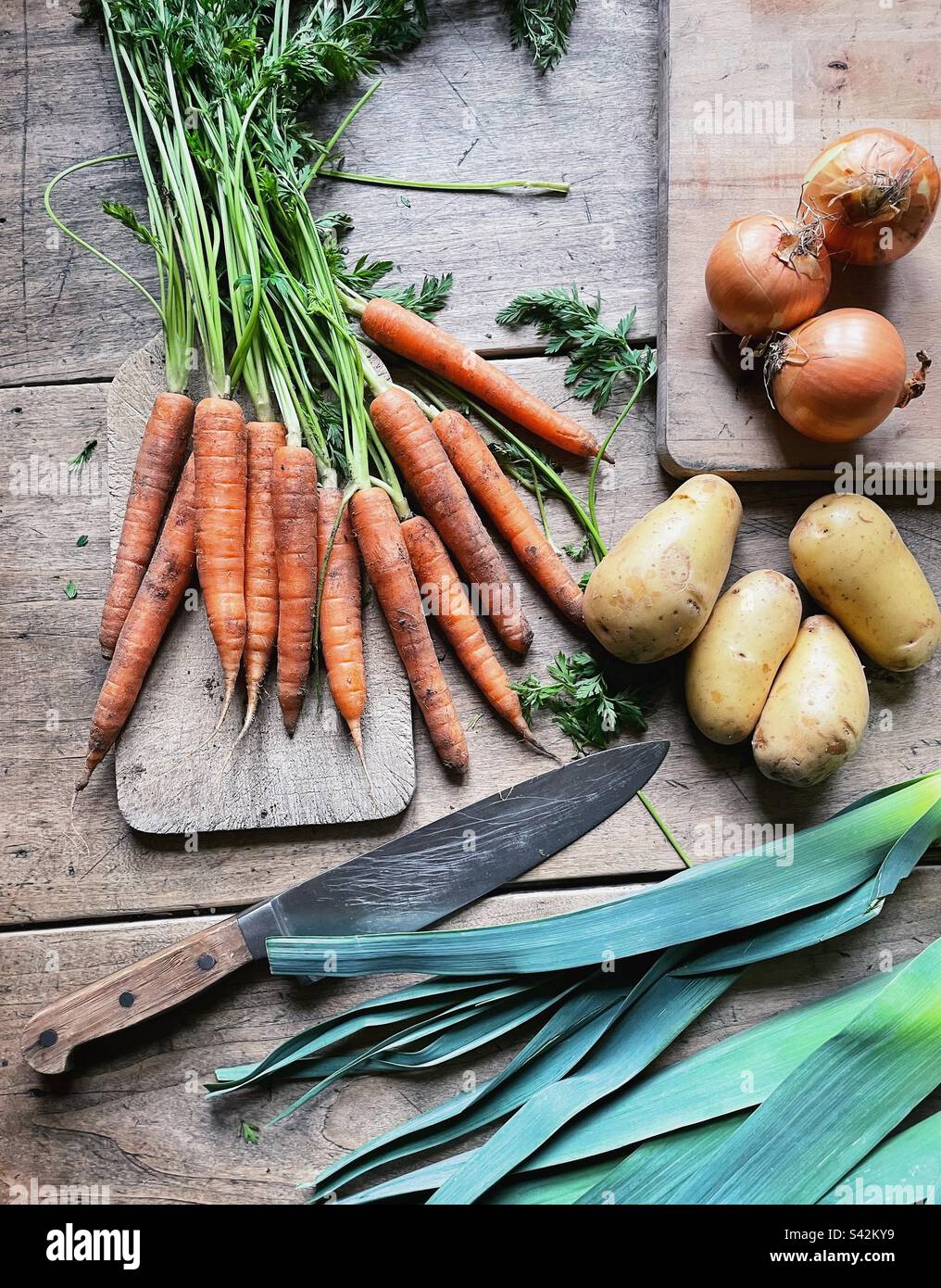 Knife and vegetables on a kitchen table - Smartphone Captured Stock Image Knife and vegetables on a kitchen table - Smartphone Captured Stock Image