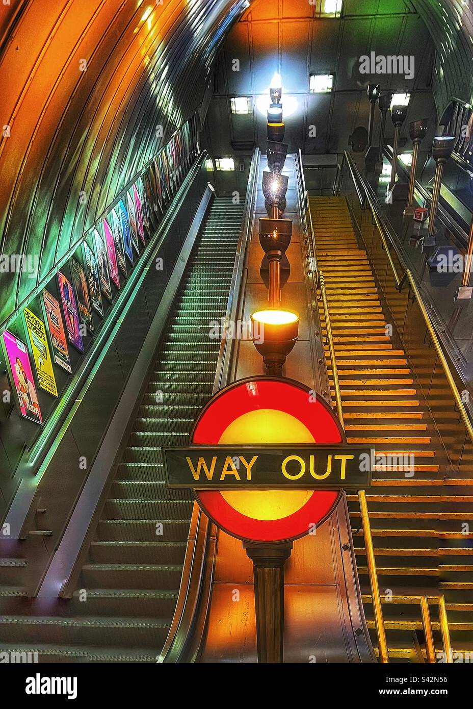 Way Out Roundel at a London Underground station at night illuminated