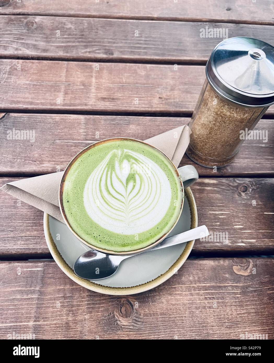 Matcha Latte. Perfect leaf latte art detail on top! Stock Photo