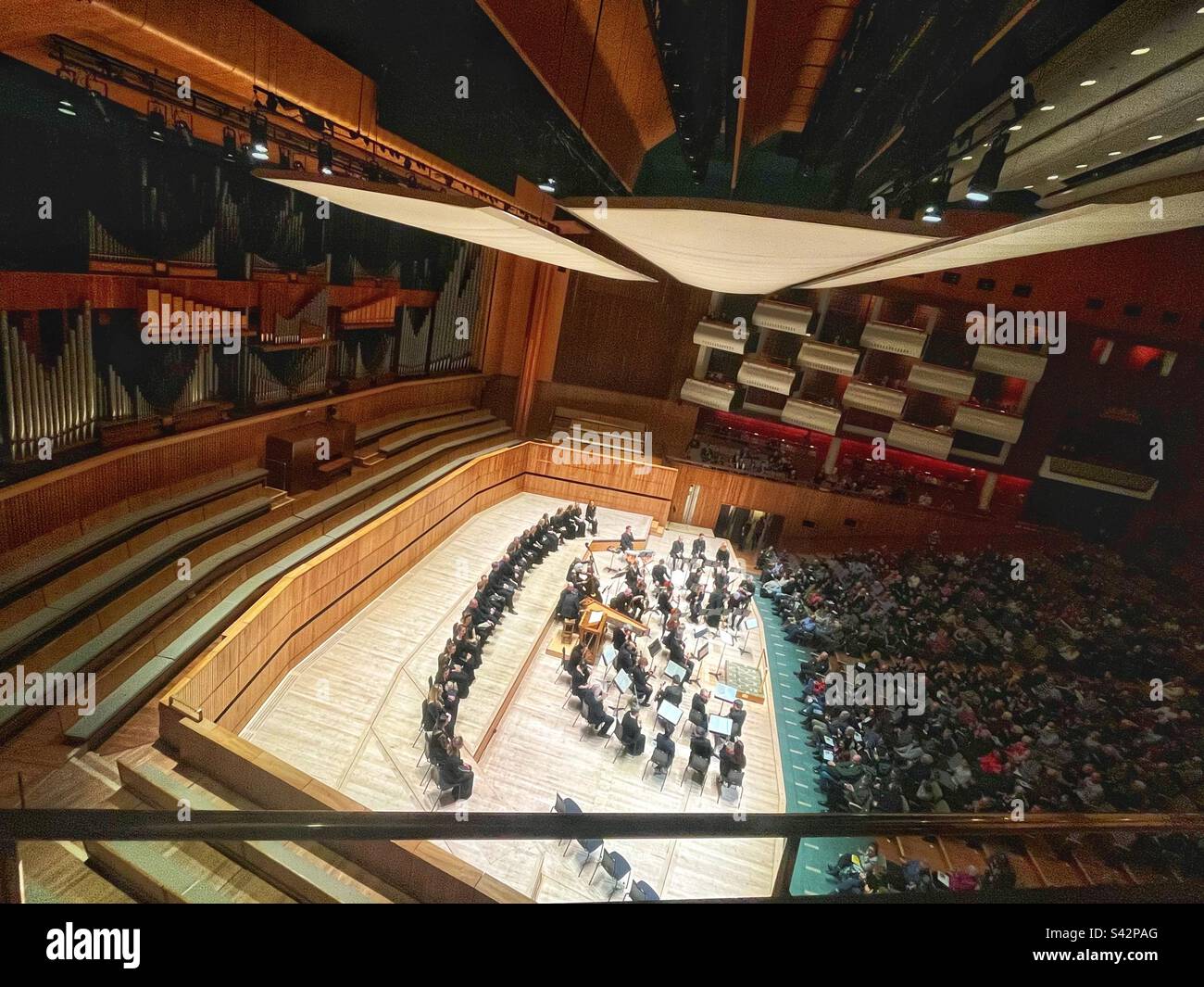 Looking at the audience and stage of the Royal Festival Hall with the Orchestra of the Age of Enlightenment in London - Smartphone Captured Stock Image