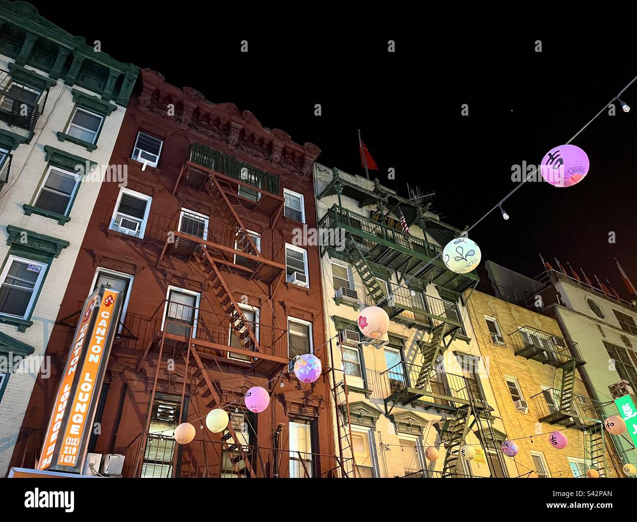 View of buildings in New York's Chinatown at night. Photo taken in New