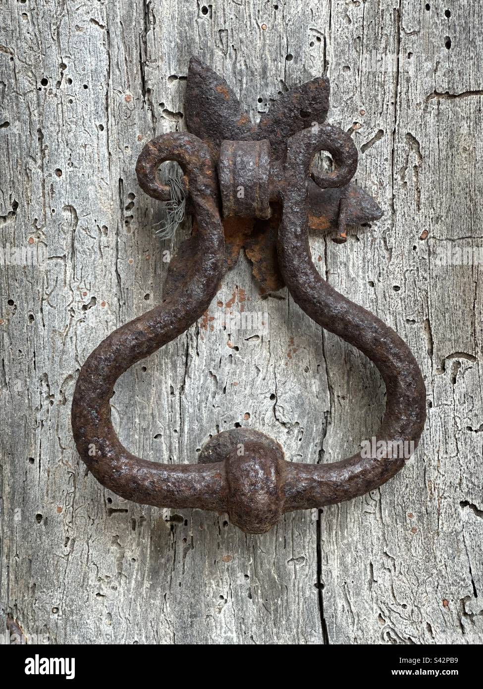 Old and rusty door knocker - Smartphone Captured Stock Image