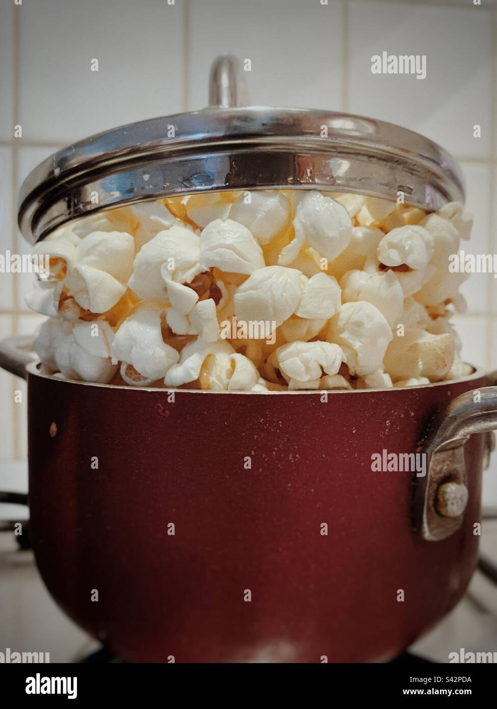 Small pot full of popcorns Stock Photo