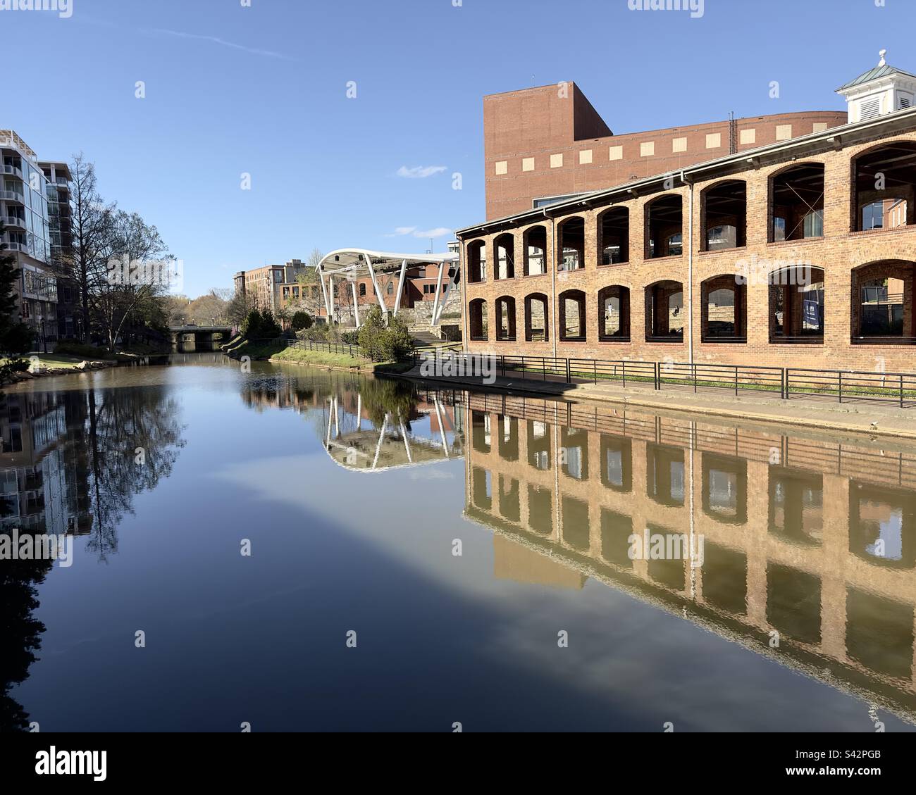 Wyche Pavilion and TD Stage on the Reedy River with reflection - Smartphone Captured Stock Image
