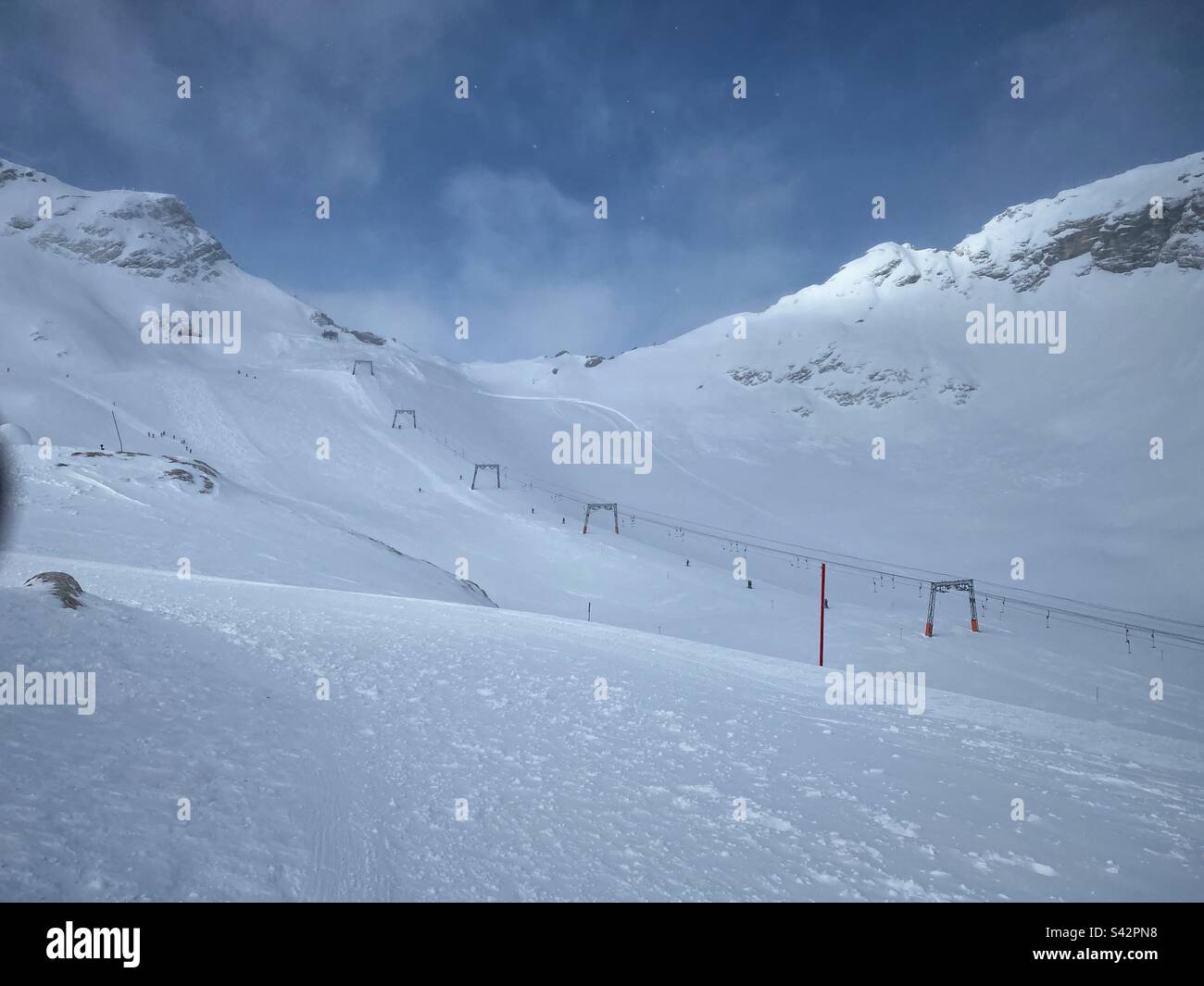 Skiing area and T-bar lift on top of Zugspitze glacier, the highest German mountain. - Smartphone Captured Stock Image